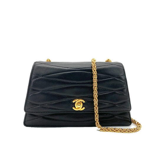 90258822 - CHANEL Vintage Black Lambskin Trapezoid Leaf shape Flap Bag