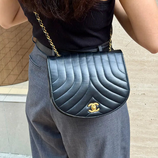JX066 - CHANEL Vintage Black Lambskin Half Moon Vertical Flap Bag
