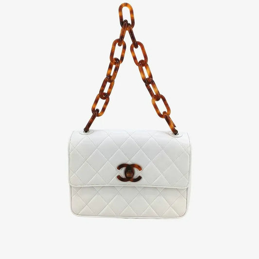 90209552-chanel-vintage-white-lambskin-tortoiseshell-quilted-flap-handbag