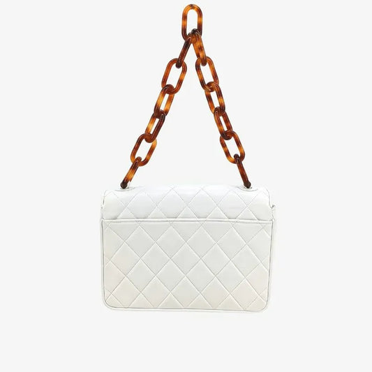 90209552-chanel-vintage-white-lambskin-tortoiseshell-quilted-flap-handbag