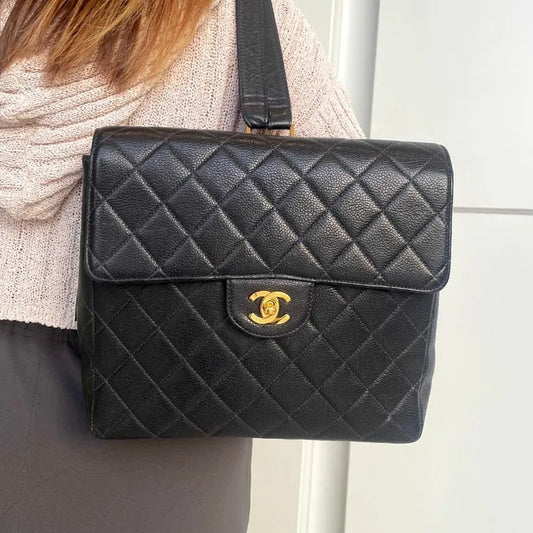 90179080-chanel-vintage-navy-caviar-leather-square-flap-backpack