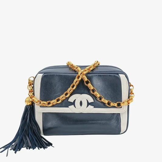90204619-chanel-vintage-navy-white-lambskin-gold-chain-camera-bag