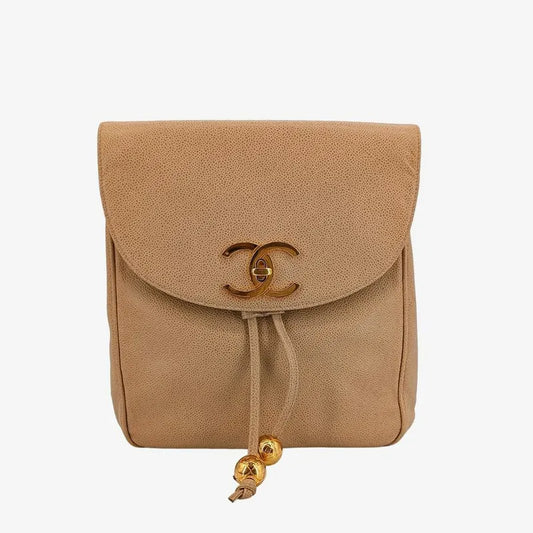 90192183-chanel-vintage-beige-caviar-leather-turnlock-flap-backpack