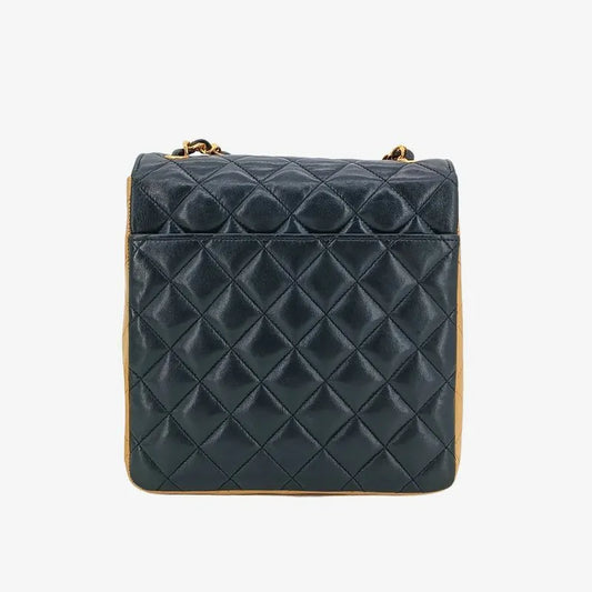 90211153-chanel-vintage-beige-black-lambskin-quilted-flap-bag