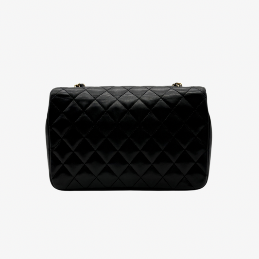 CS079 - CHANEL Vintage Black Lambskin Half Moon Flap Bag