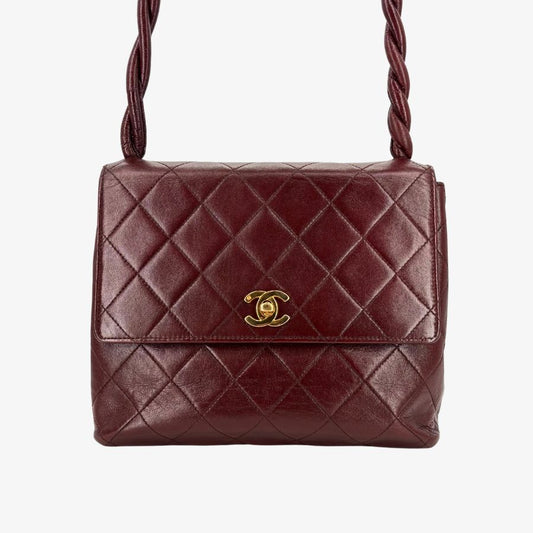 C663 - CHANEL Vintage Twisted Strap Burgundy Lambskin Flap Bag