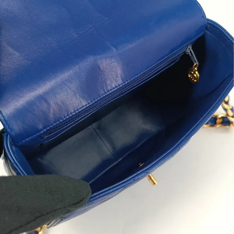 90201290-chanel-vintage-blue-lambskin-flap-bag