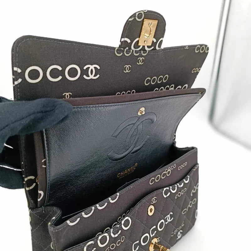 90173728-chanel-vintage-black-canvas-coco-print-flap-bag