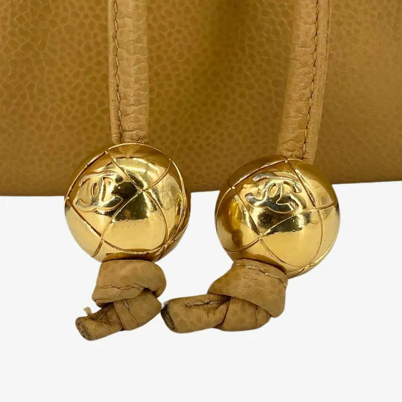 rc295-chanel-vintage-beige-caviar-leather-turnlock-flap-backpack