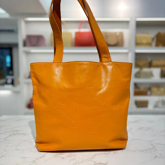 jw563-chanel-vintage-mustard-lambskin-cc-embossed-tote-bag