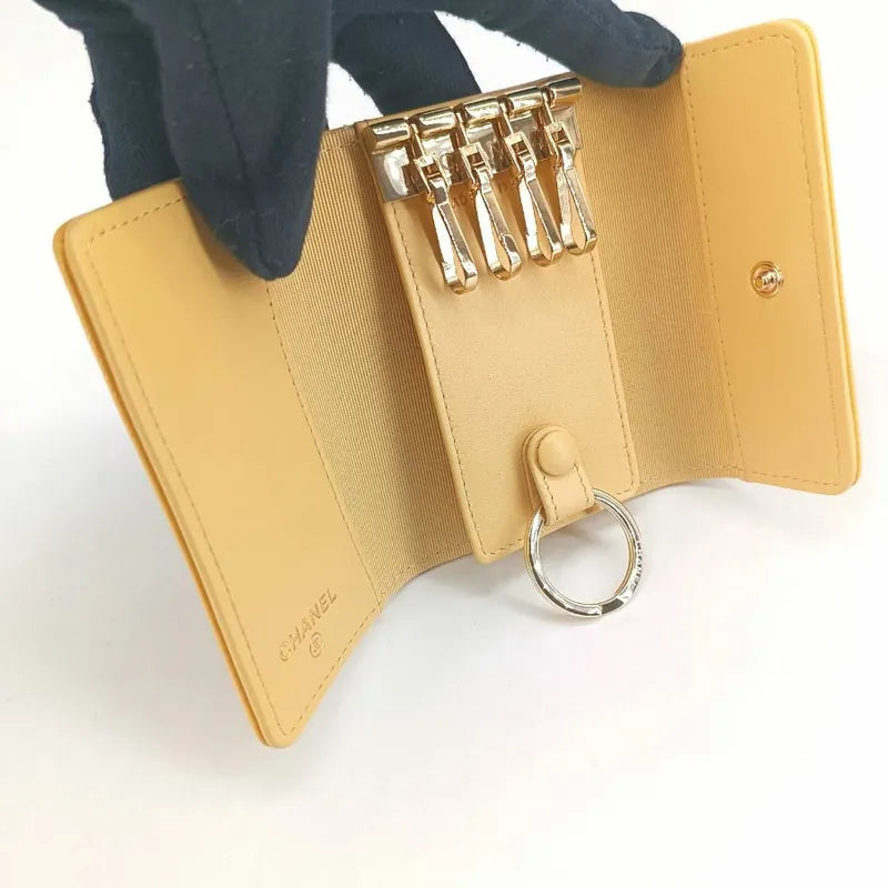 jt400-chanel-yellow-caviar-leather-camellia-flap-4-key-holder