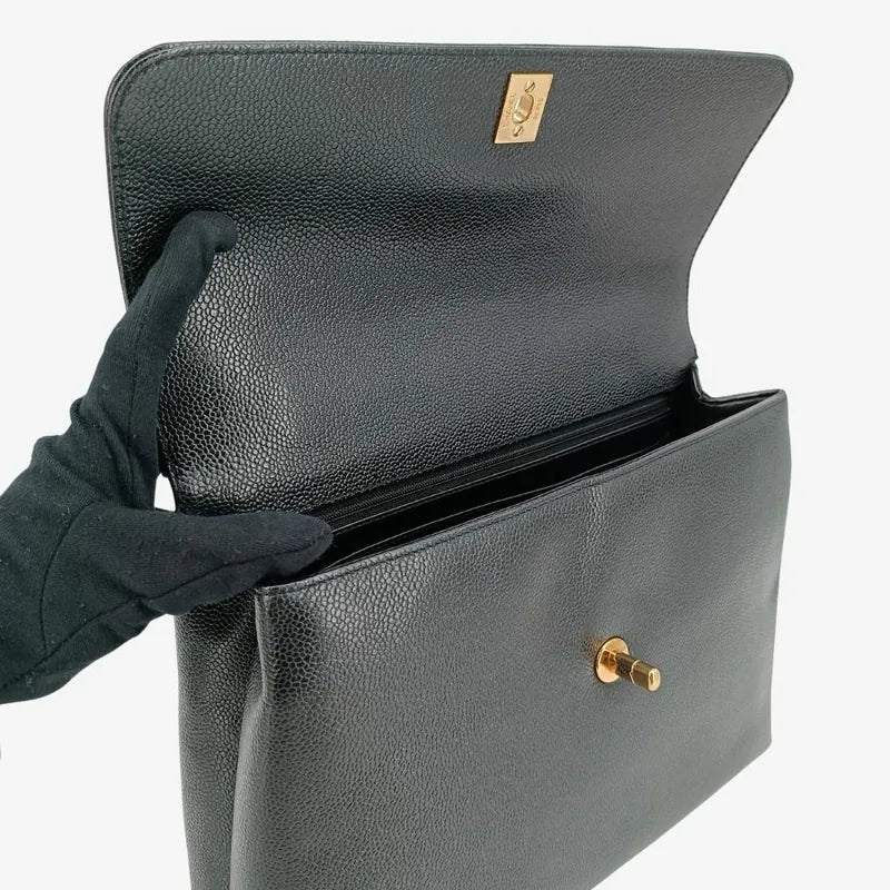 ra468-chanel-vintage-black-caviar-leather-kelly-handbag