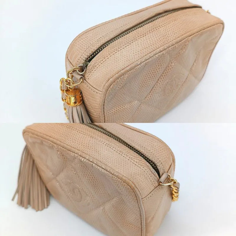 jah164-chanel-vintage-pink-lizard-skin-tassel-camera-bag