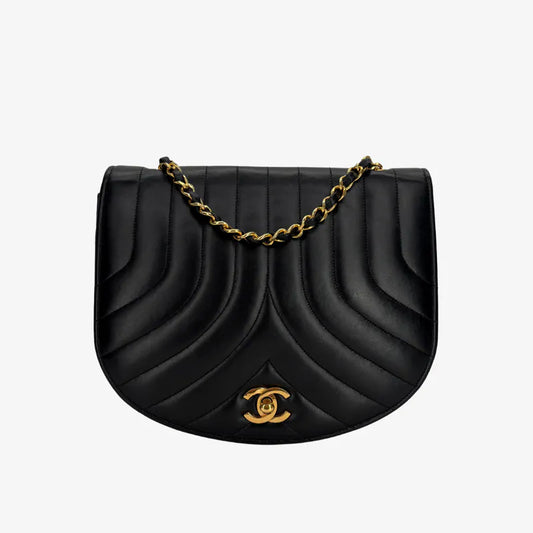 JX066 - CHANEL Vintage Black Lambskin Half Moon Vertical Flap Bag