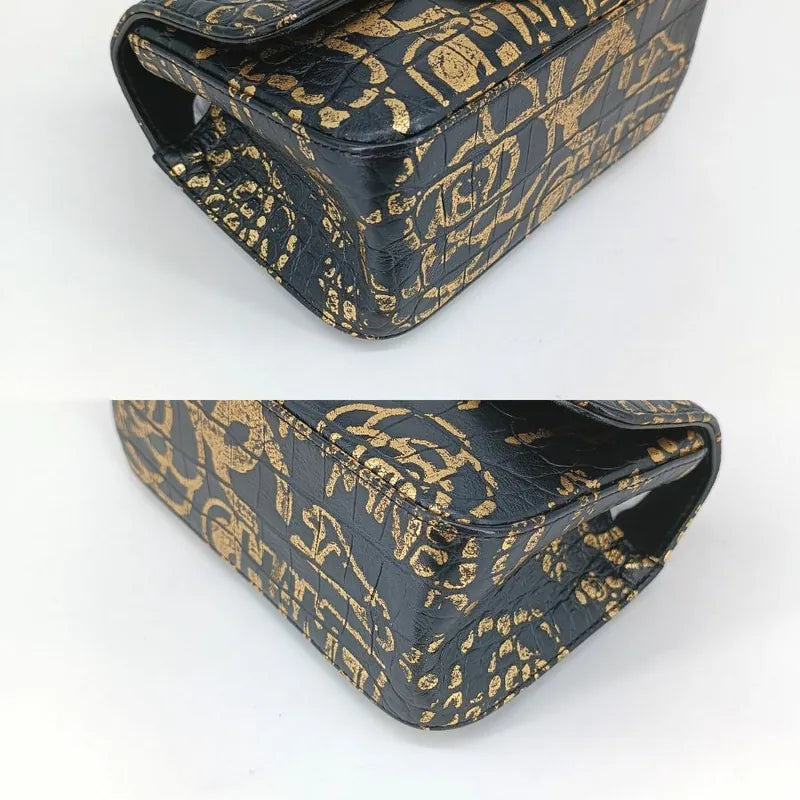 90190312-chanel-black-and-gold-graffiti-calfskin-crocodile-embossed-255-flap-bag