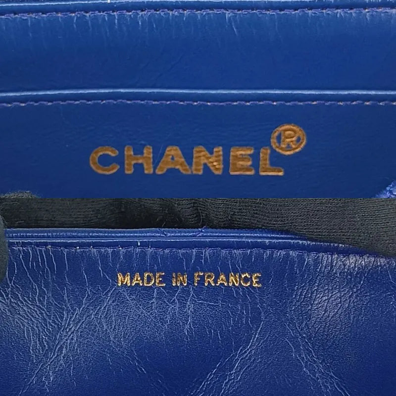 90201290-chanel-vintage-blue-lambskin-flap-bag