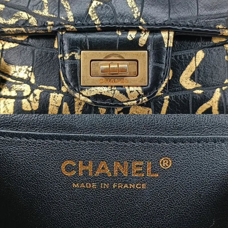 90190312-chanel-black-and-gold-graffiti-calfskin-crocodile-embossed-255-flap-bag