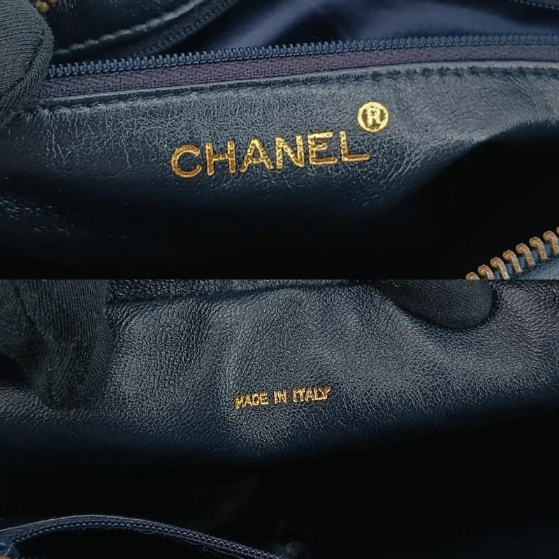 jt267-chanel-vintage-navy-lambskin-tassel-camera-bag