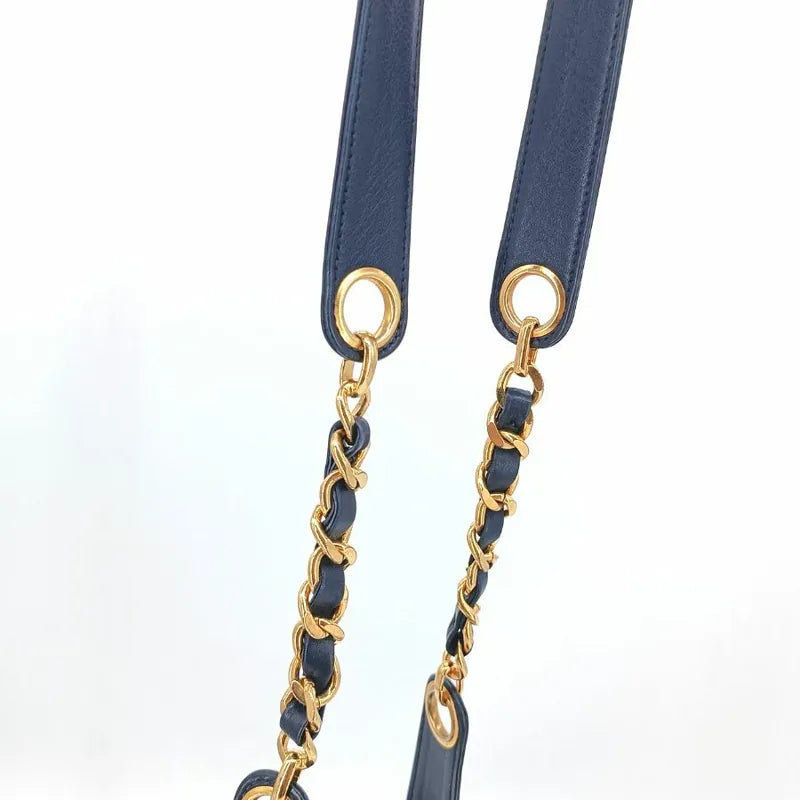 ra140-chanel-vintage-navy-lambskin-gold-ball-bucket-bag