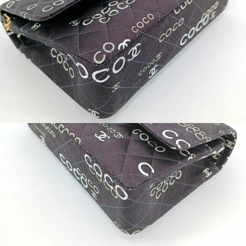 90173728-chanel-vintage-black-canvas-coco-print-flap-bag