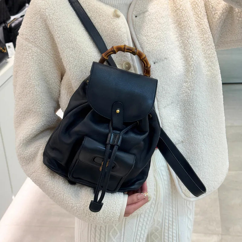 rc147-gucci-vintage-navy-leather-bamboo-backpack