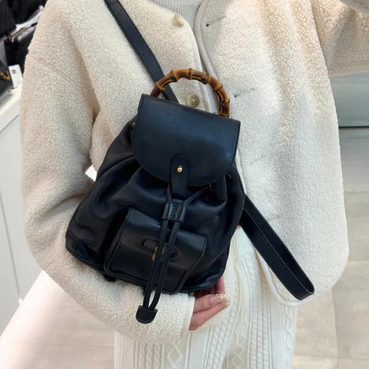 rc147-gucci-vintage-navy-leather-bamboo-backpack