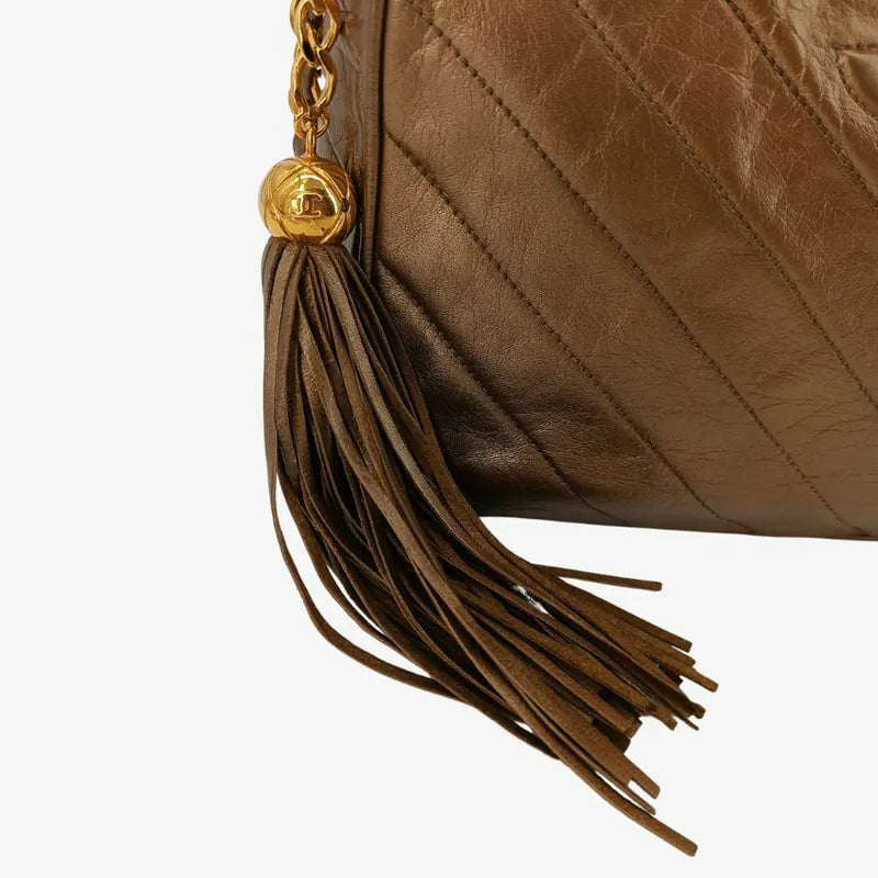jah153-chanel-vintage-gold-lambskin-tassel-cross-stripe-camera-bag
