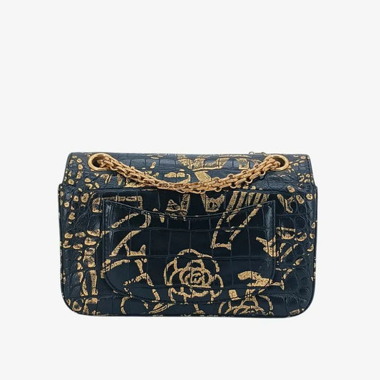 90213845-chanel-black-and-gold-graffiti-calfskin-crocodile-embossed-255-flap-bag