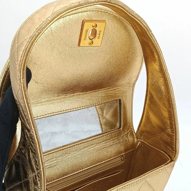 c386-chanel-vintage-gold-lambskin-quilted-handbag