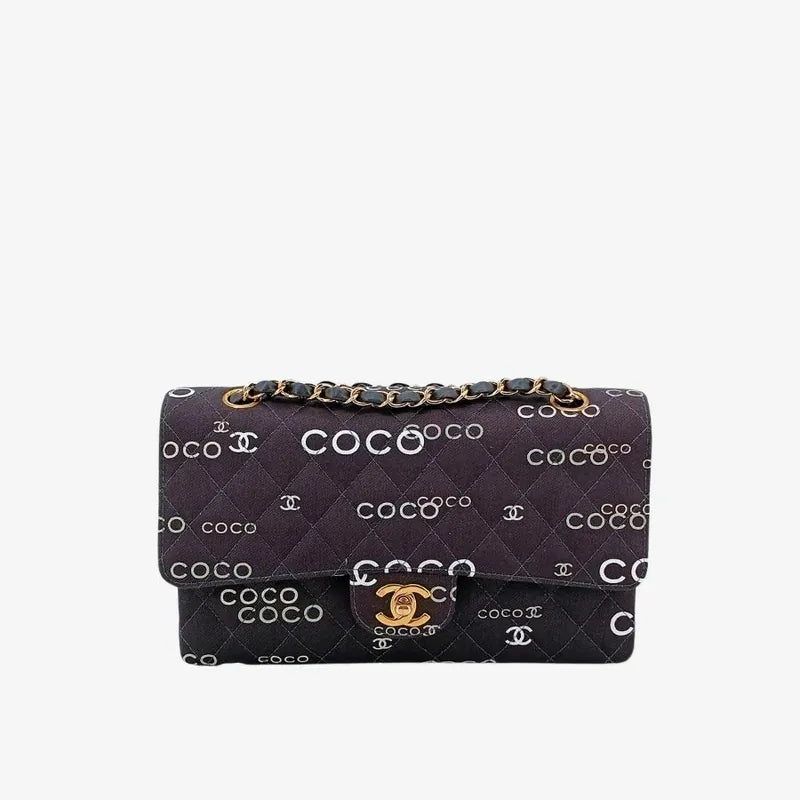 90173728-chanel-vintage-black-canvas-coco-print-flap-bag