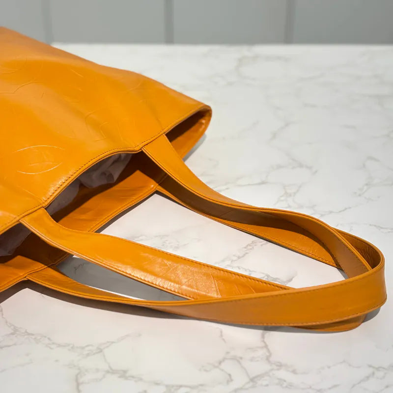 jw563-chanel-vintage-mustard-lambskin-cc-embossed-tote-bag