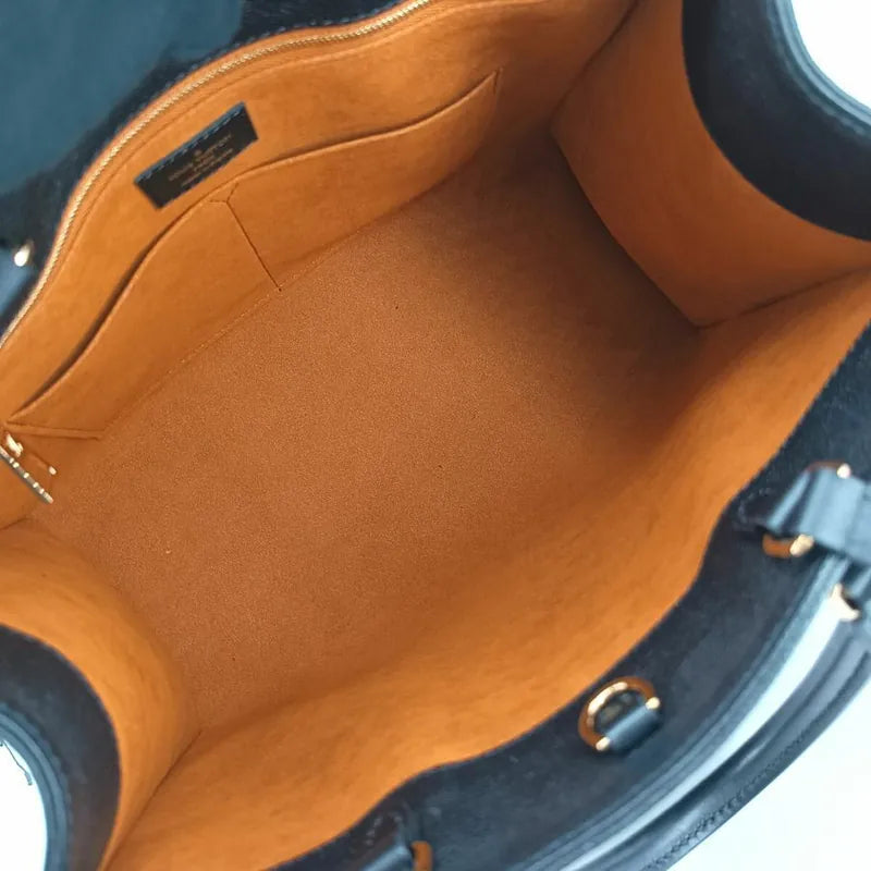 js540-louis-vuitton-onthego-monogram-empreinte-mm