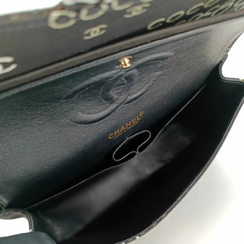90173728-chanel-vintage-black-canvas-coco-print-flap-bag