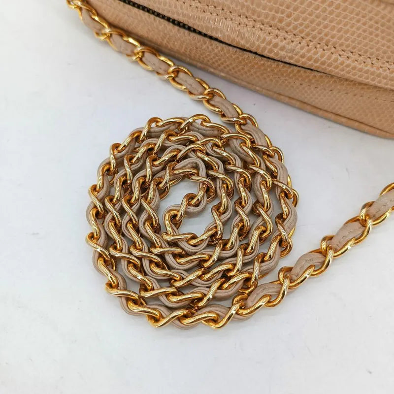 jah164-chanel-vintage-pink-lizard-skin-tassel-camera-bag