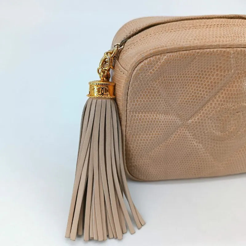 jah164-chanel-vintage-pink-lizard-skin-tassel-camera-bag