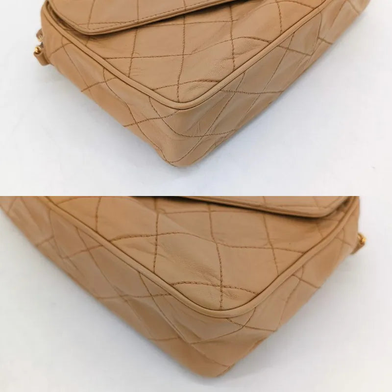 ju350-chanel-vintage-beige-lambskin-tassel-camera-bag