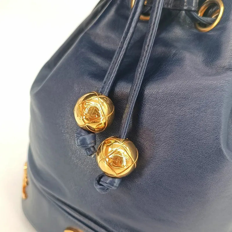 ra140-chanel-vintage-navy-lambskin-gold-ball-bucket-bag