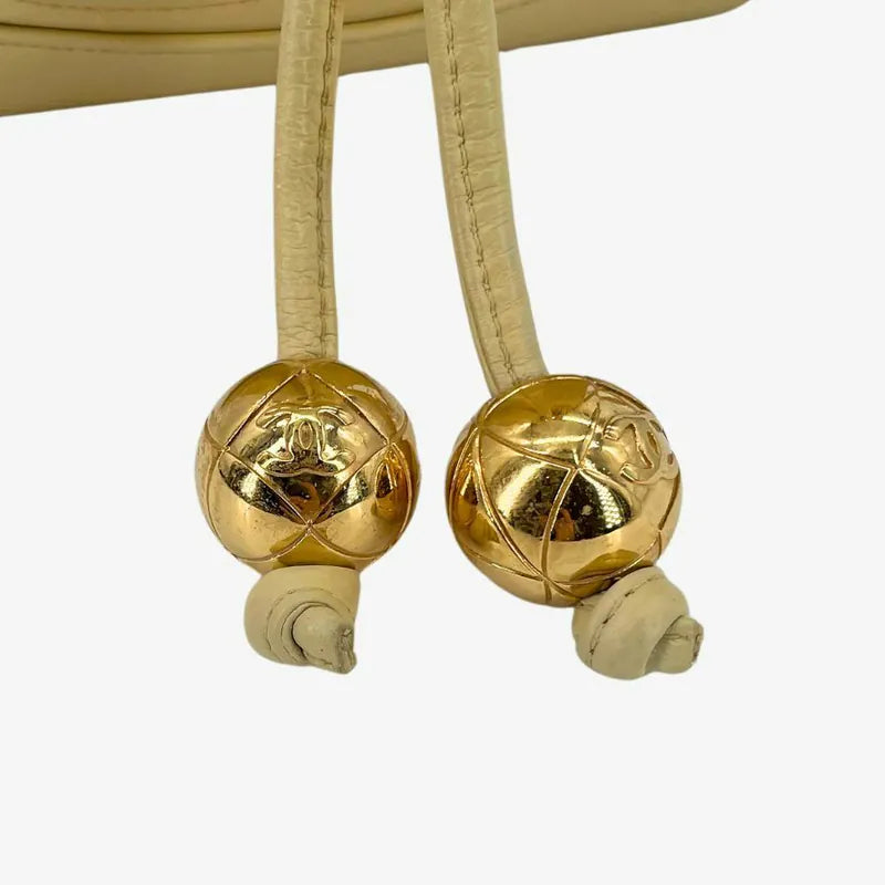 jw565-chanel-vintage-beige-lambskin-golden-ball-mini-bucket-bag