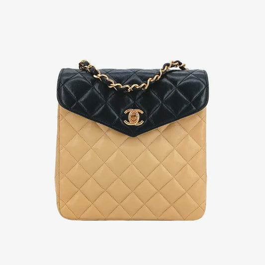 90211153-chanel-vintage-beige-black-lambskin-quilted-flap-bag