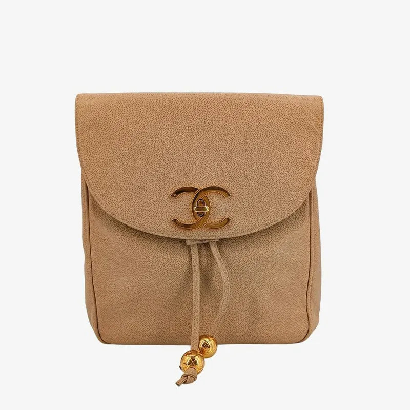 90192183-chanel-vintage-beige-caviar-leather-turnlock-flap-backpack