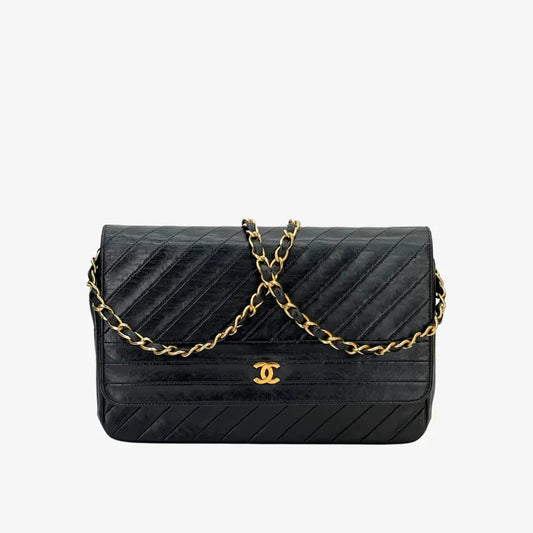 JW371 - CHANEL Vintage Black Lambskin Diagonal Flap Bag