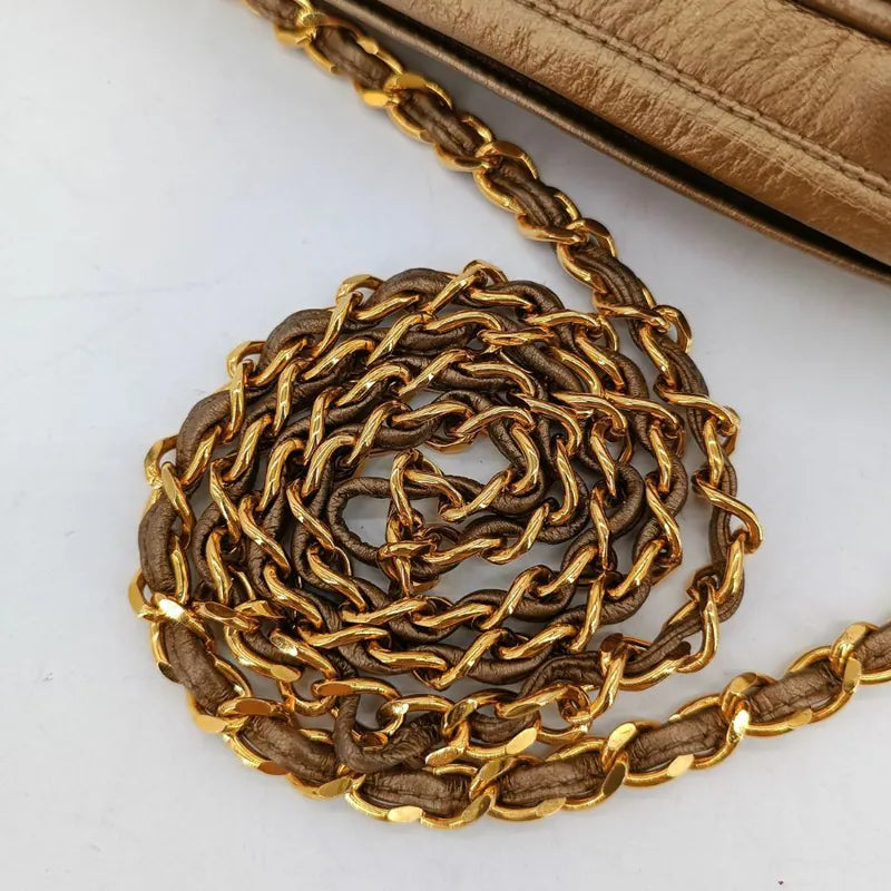 jah153-chanel-vintage-gold-lambskin-tassel-cross-stripe-camera-bag