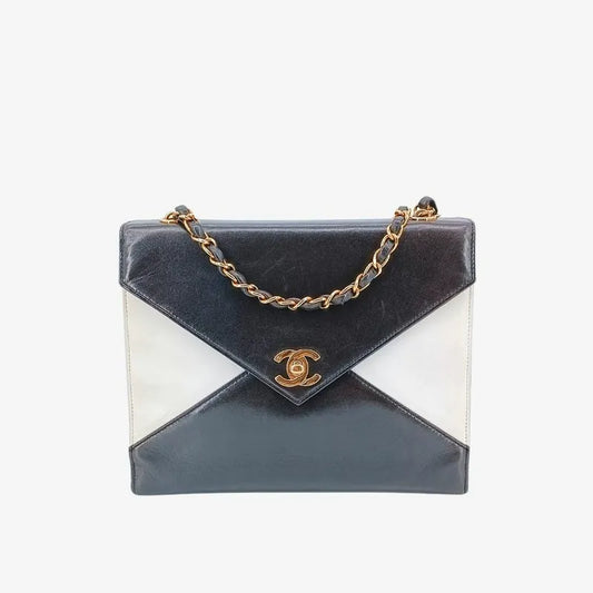 90175500-chanel-vintage-bicolor-black-white-lambskin-envelope-flap-bag