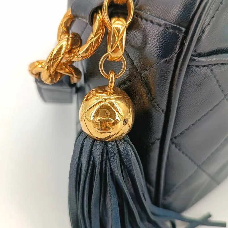 js491-chanel-vintage-black-lambskin-quilted-tassels-camera-bag