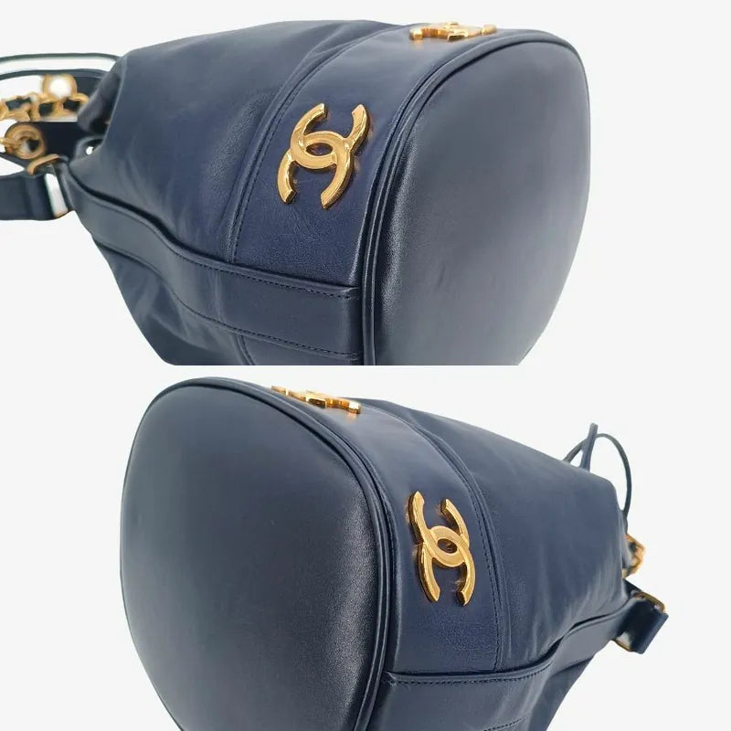 ra140-chanel-vintage-navy-lambskin-gold-ball-bucket-bag