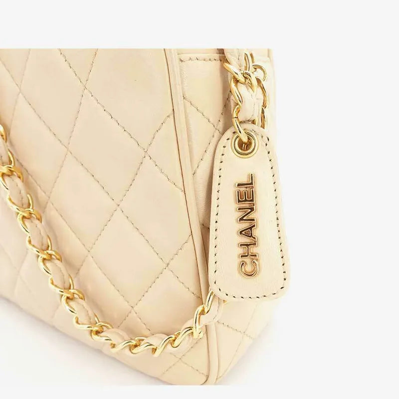 js006-chanel-vintage-beige-lambskin-quilted-camera-bag