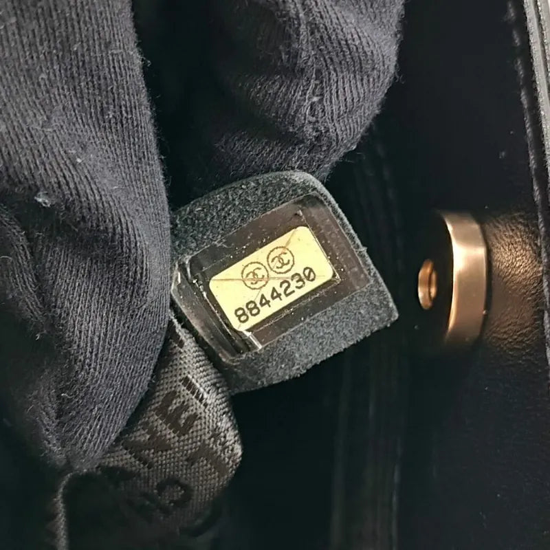 ra372-chanel-vintage-black-lambskin-precious-symbols-embossed-tote-bag