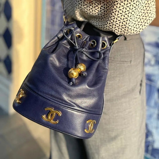 ra140-chanel-vintage-navy-lambskin-gold-ball-bucket-bag