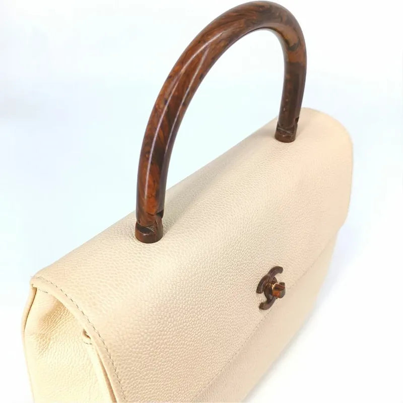90198834-chanel-vintage-white-caviar-leather-wood-top-handle-bag