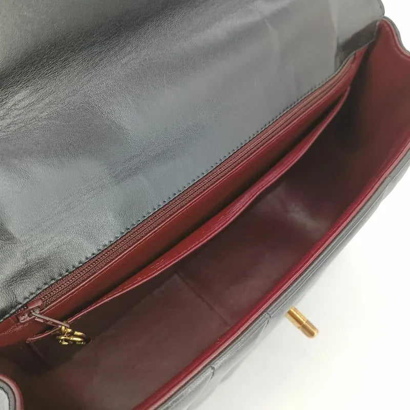 ra658-chanel-vintage-black-lambskin-vertical-flap-handbag